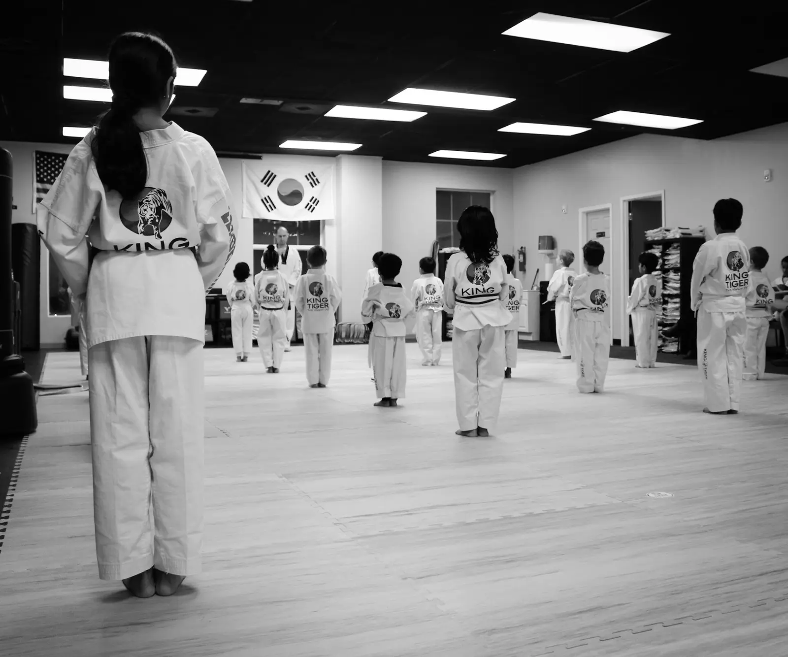 King Tiger students standing together at attention during class