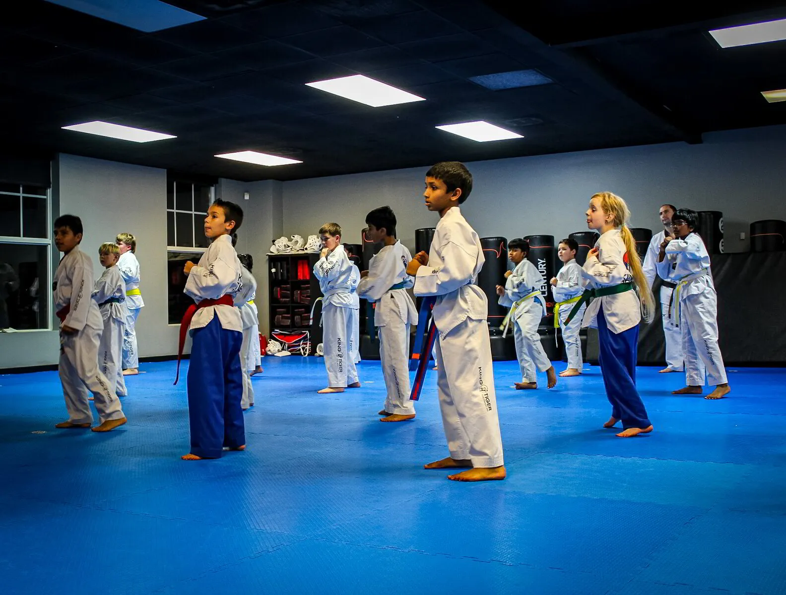 King Tiger students learning together on the blue mat