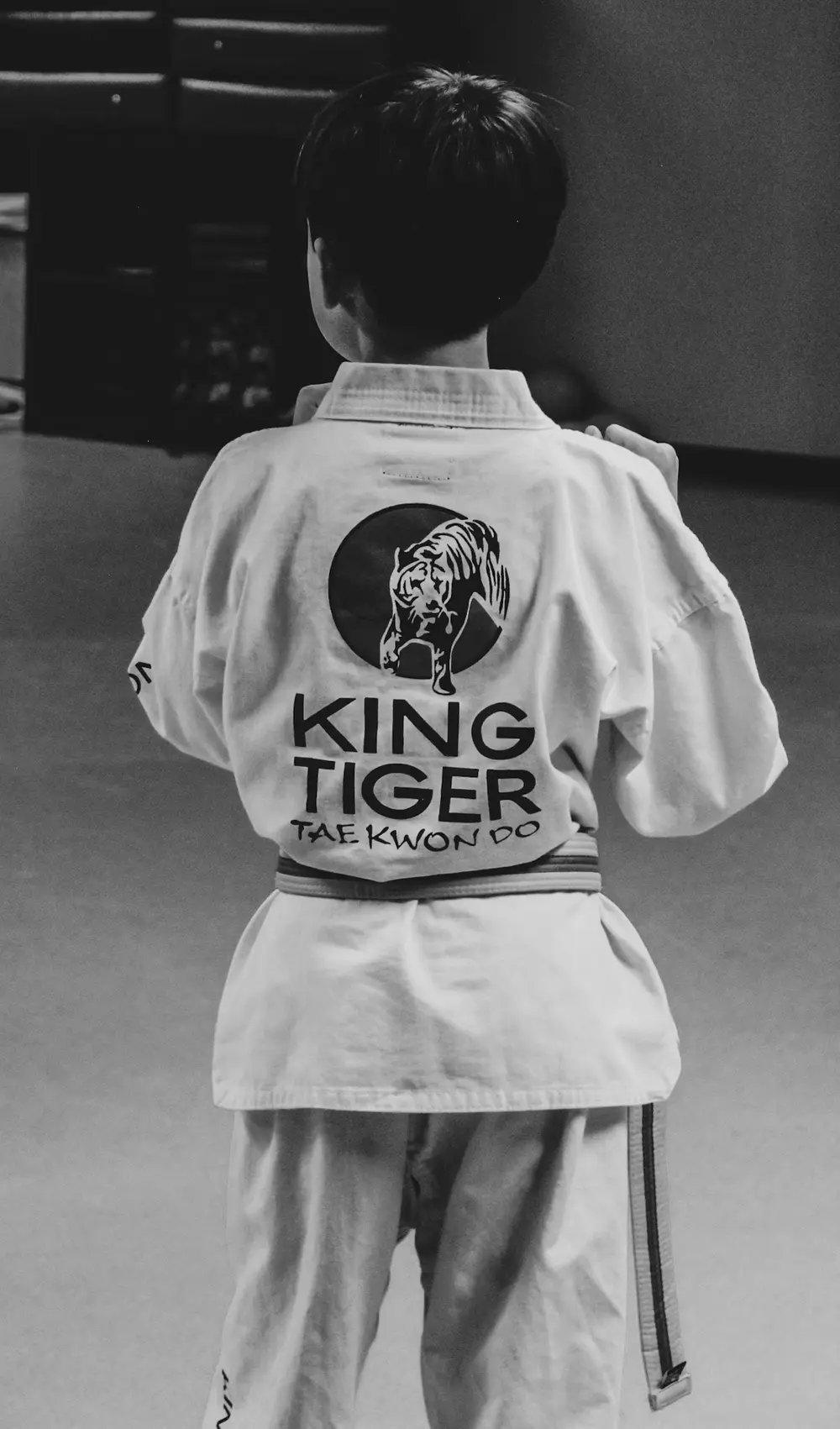 A young King Tiger student wearing the studio emblem