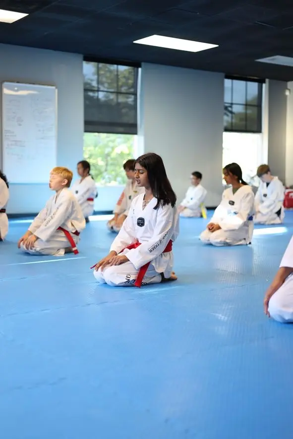 A King Tiger teen student beginning class with calm focus